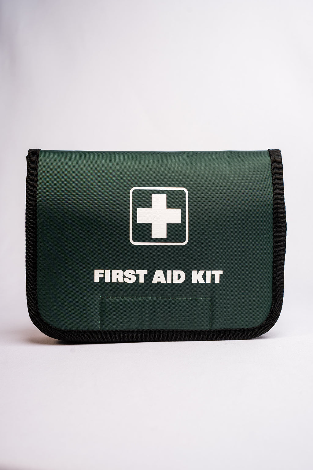 Green first aid kit with a white cross symbol on a white background