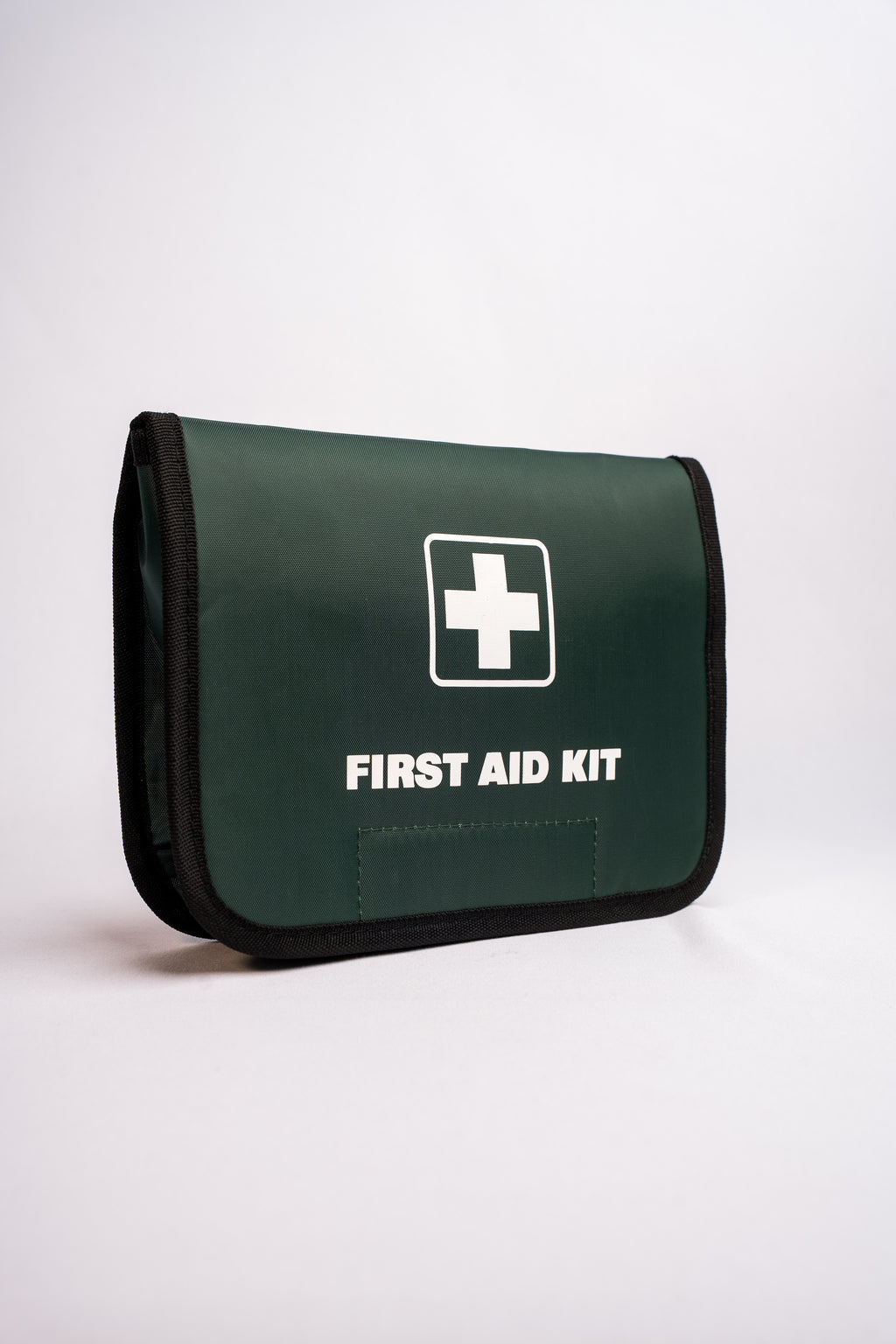Green first aid kit with a white cross symbol on a white background
